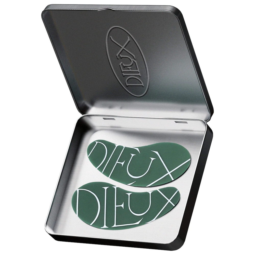 Dieux Forever Eye Masks displayed inside their open metal case on a white background