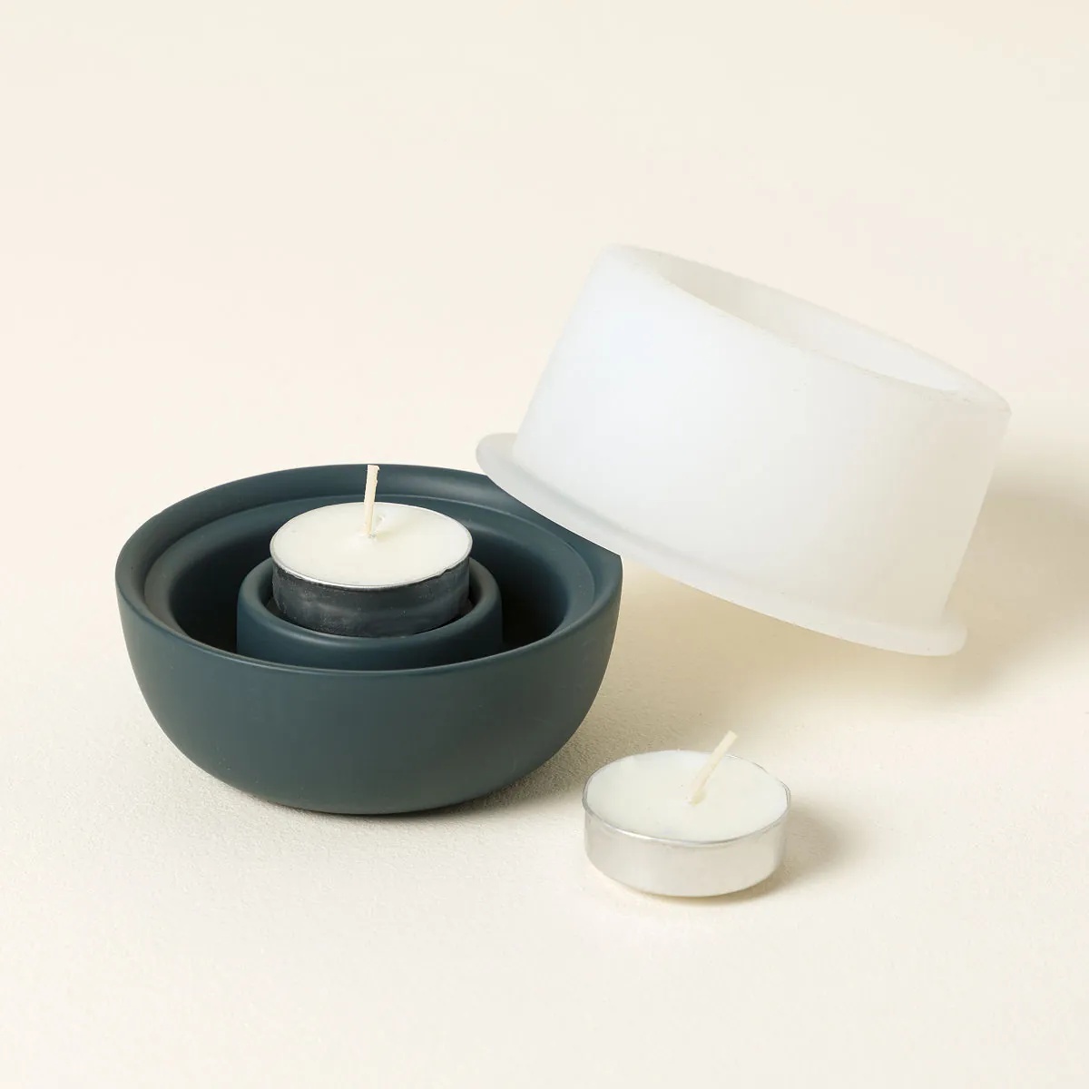 Dark green Fire & Ice Transforming Candle Holder with candle and ice mold