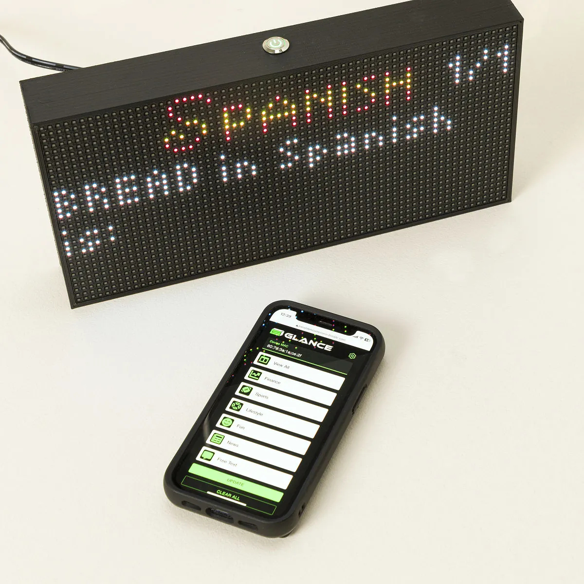 GLANCE Personalized Home LED Ticker displayed with its personalization app on a phone